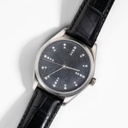 Todd Reed watch made with Stainless steel, sterling silver, and white brilliant cut diamonds (.24ct) on a leather strap